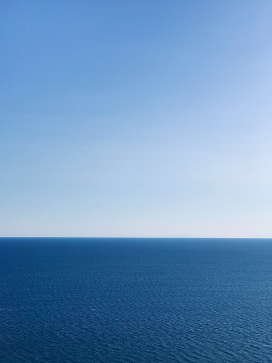 blue ocean under blue sky during daytime