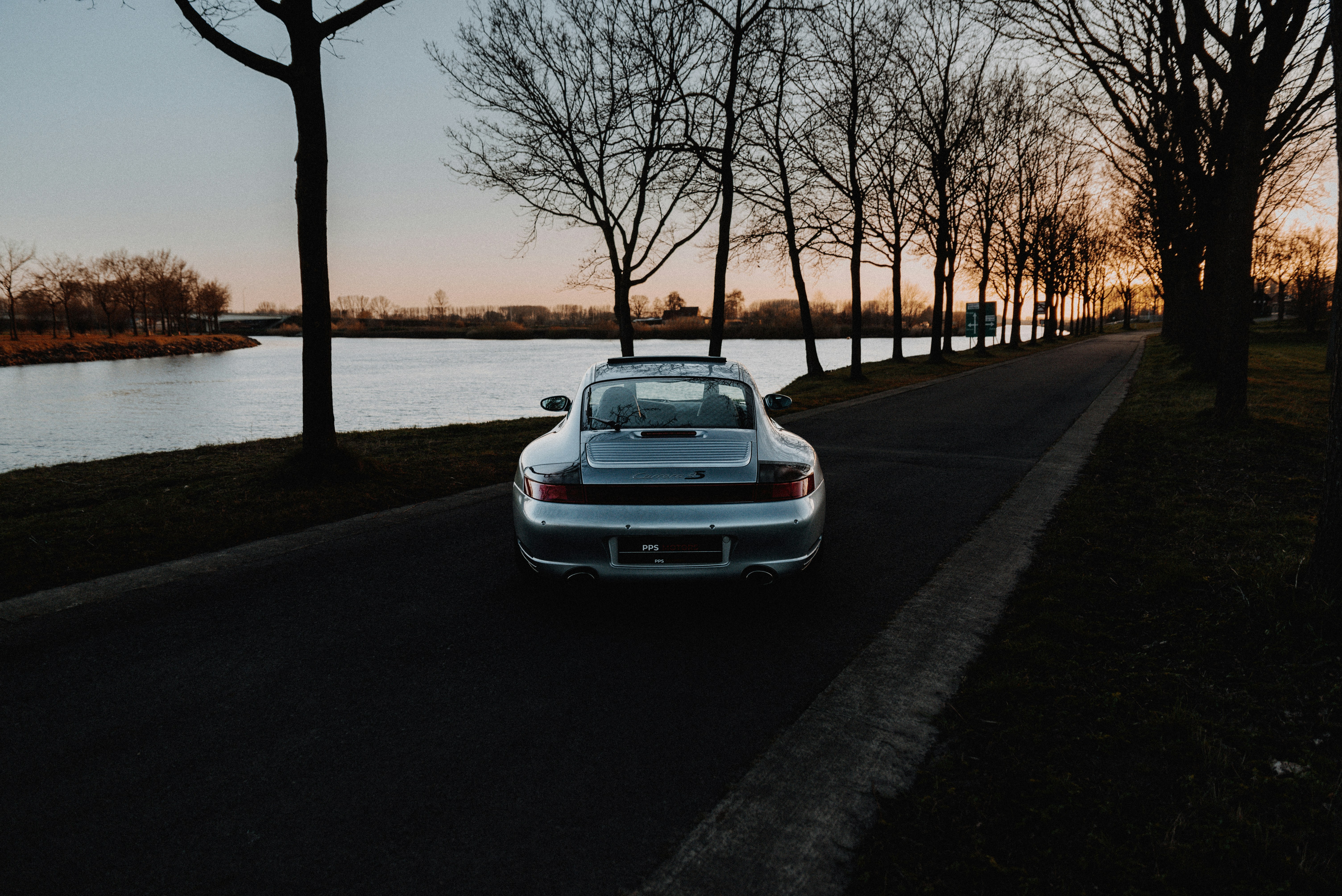 White car parked on sidewalk during sunset - null wallpaper in 6016x4016 resolution