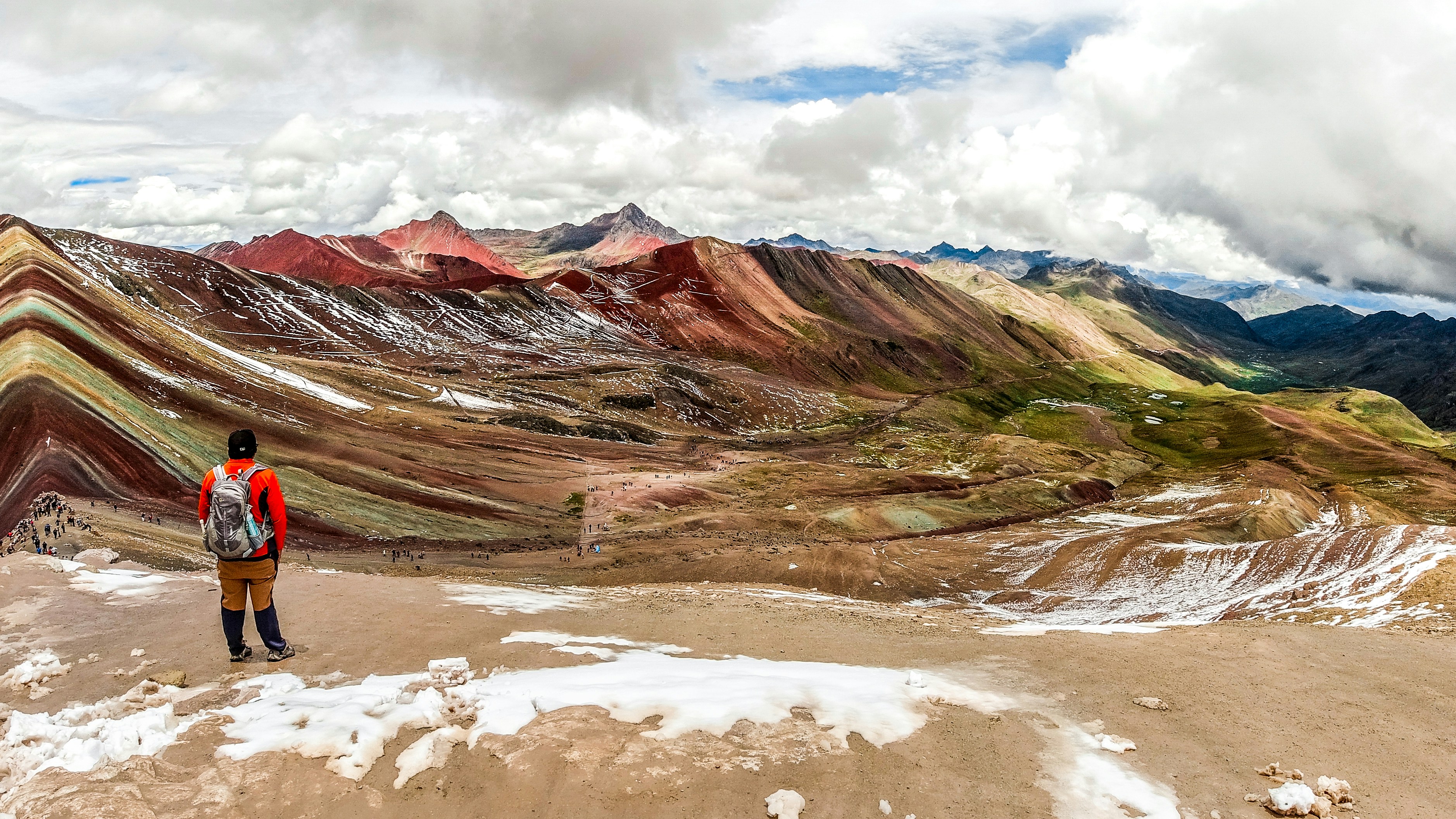 brown and gray mountains under white clouds