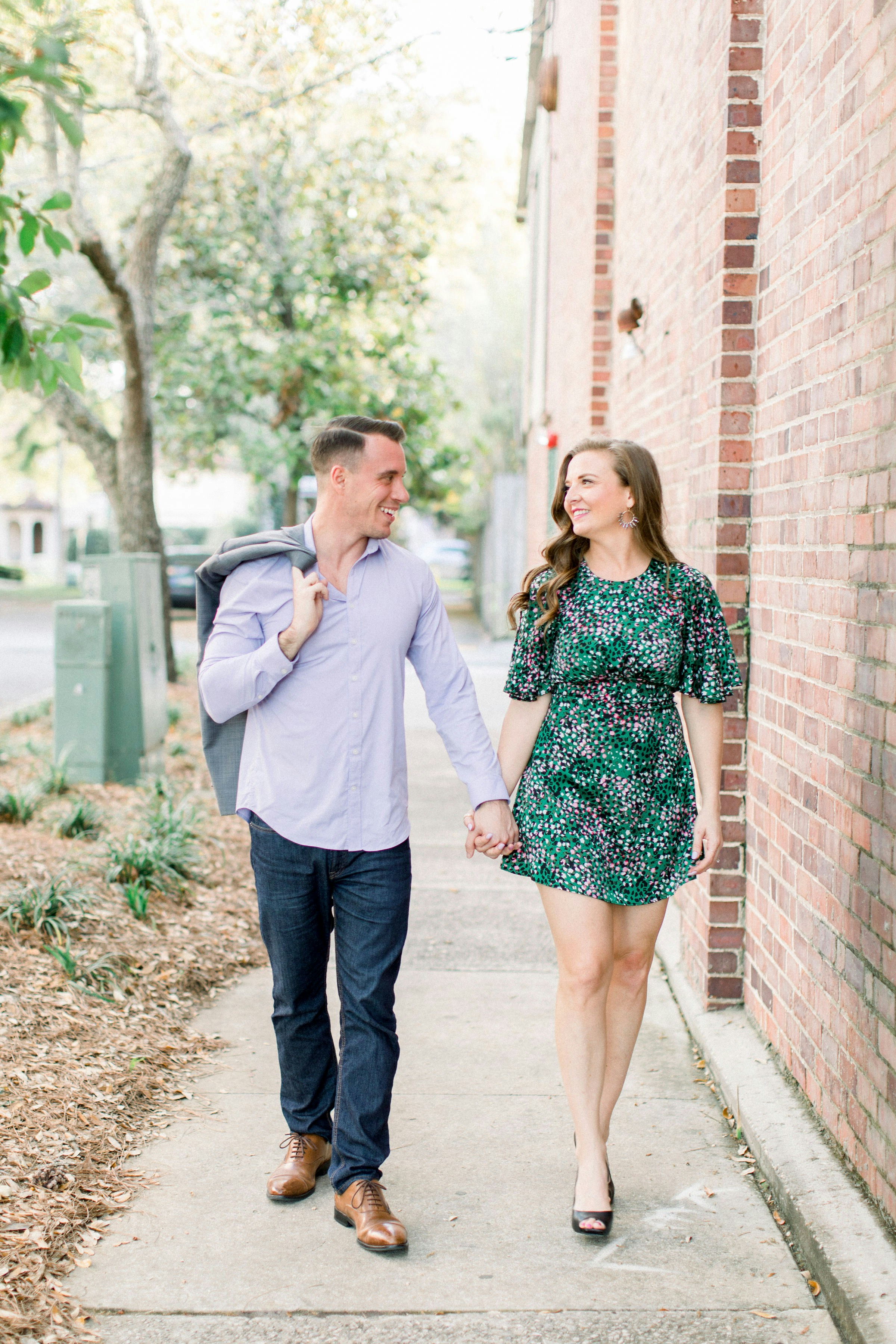 great photo recipe,how to photograph couple walking, couple smiling at each other, love, couple holding hands, learn more about the models, alex sanfilippo and alecia sanfilippo @ podpros.com; man and woman standing beside brick wall during daytime