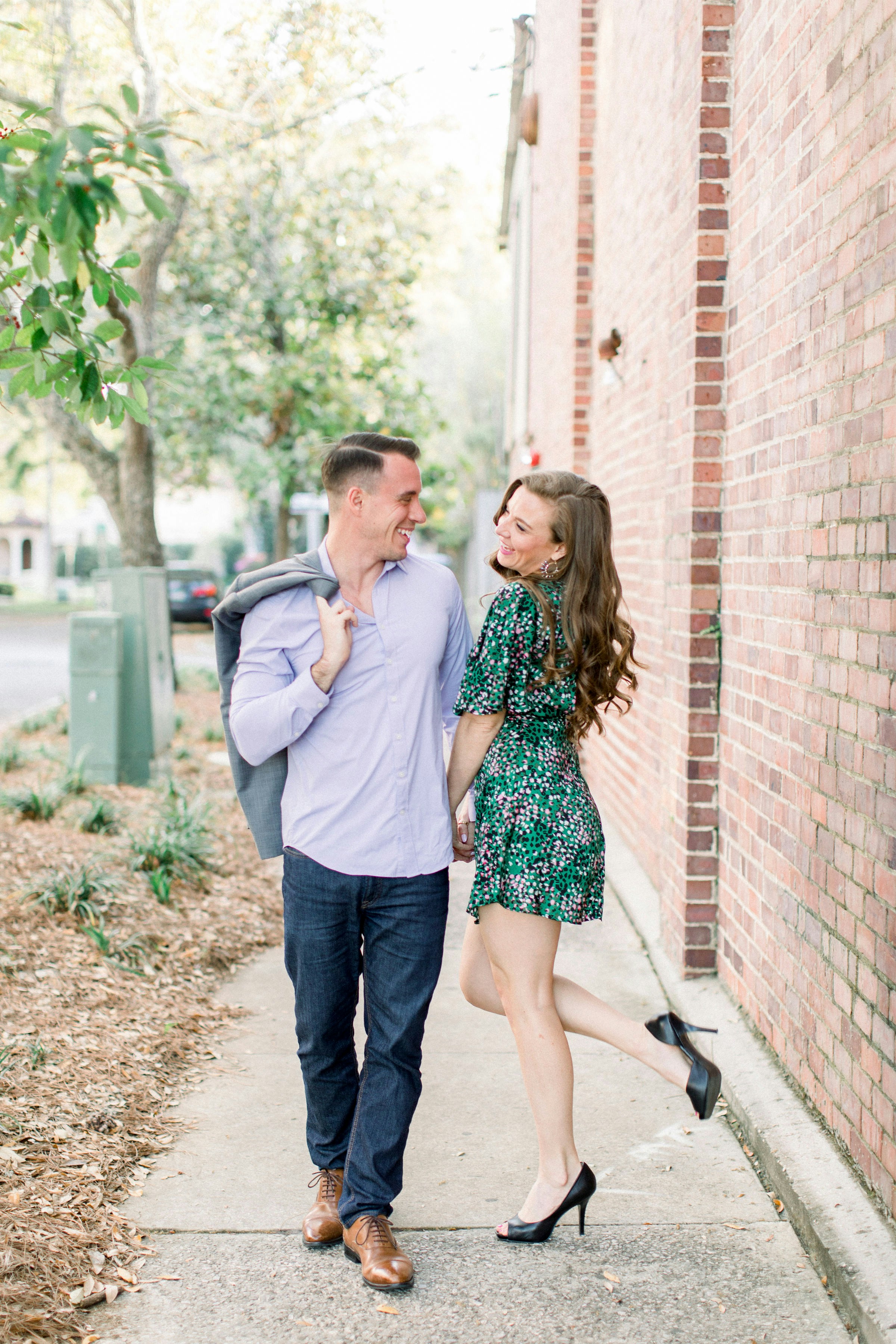 great photo recipe,how to photograph couple walking, couple laughing, couple smiling at each other, love, couple holding hands, learn more about the models, alex sanfilippo and alecia sanfilippo @ podpros.com; woman in white long sleeve shirt standing beside woman in green and white floral dress