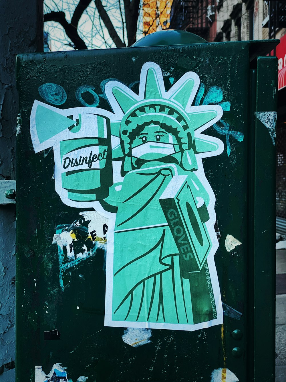 white and green graffiti on black wooden door