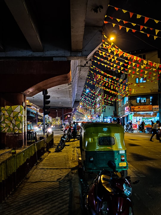 people walking on sidewalk during night time in Bellandur India