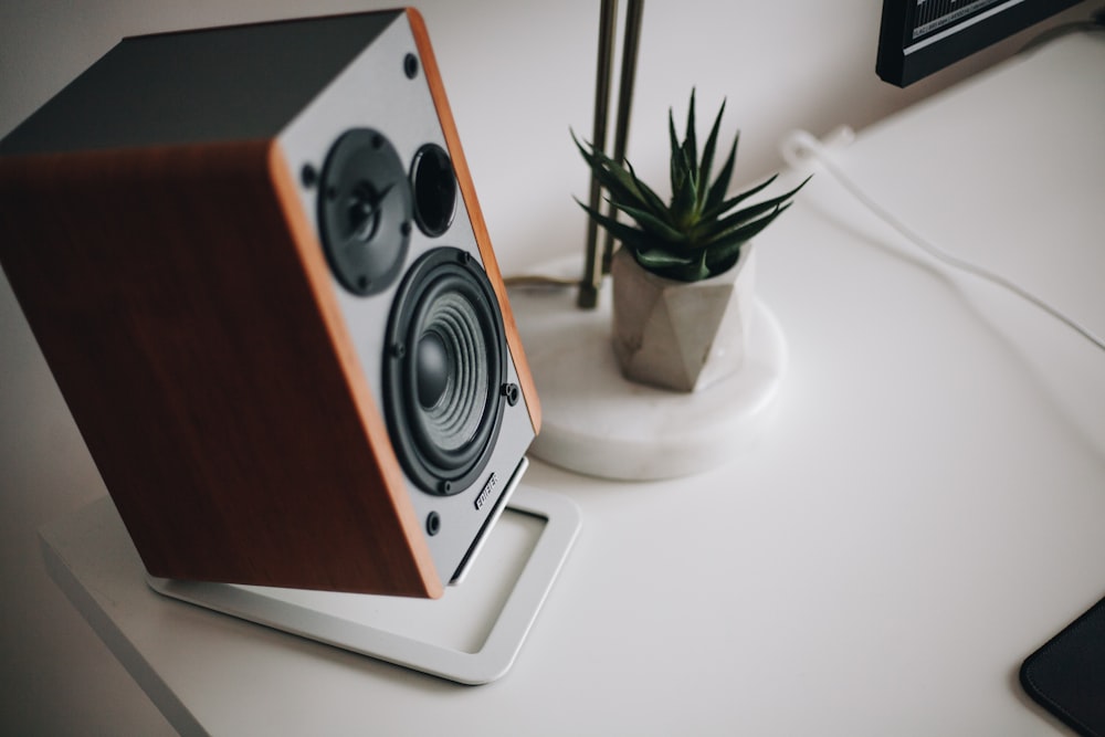 black and brown speaker on white table