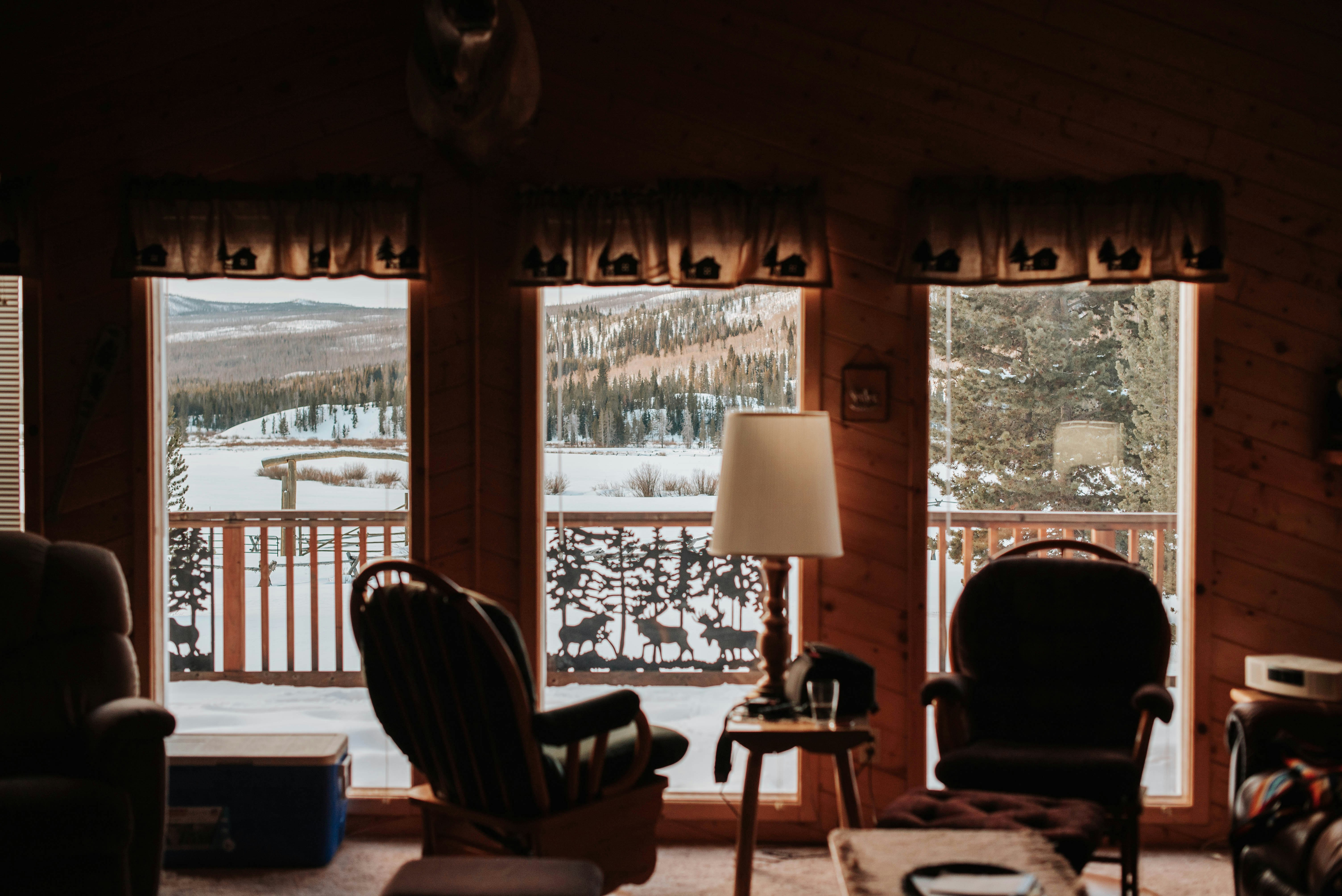 brown wooden chair near window