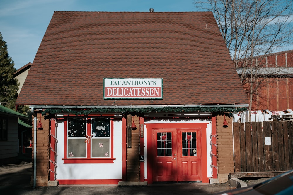 brown brick building with red wooden door