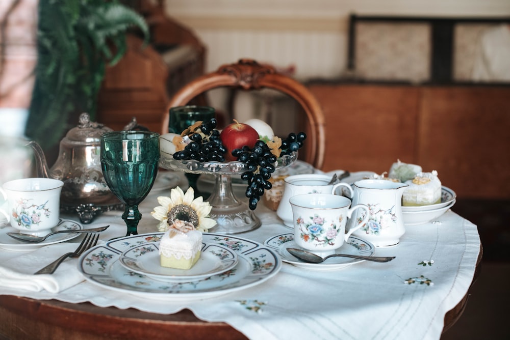 white and blue floral ceramic teacup on saucer