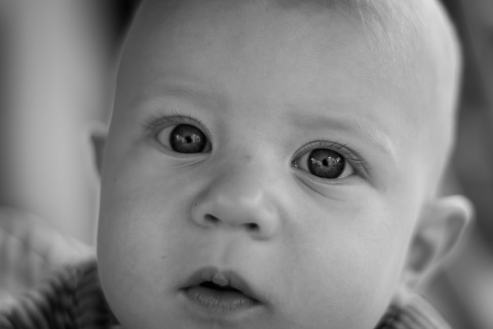grayscale photo of babys face