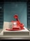red and white rotary telephone on white table