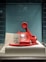 red and white rotary telephone on white table