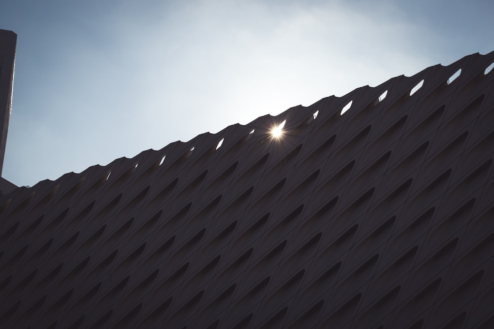 brown brick wall under blue sky during daytime