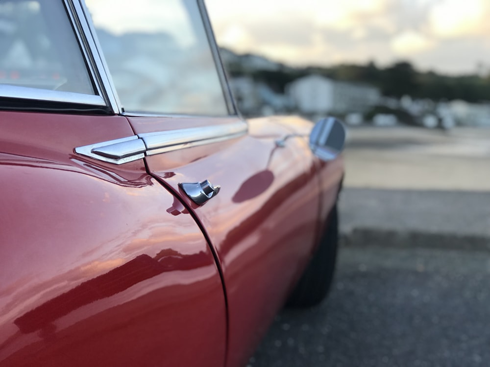 a red car parked on the side of the road