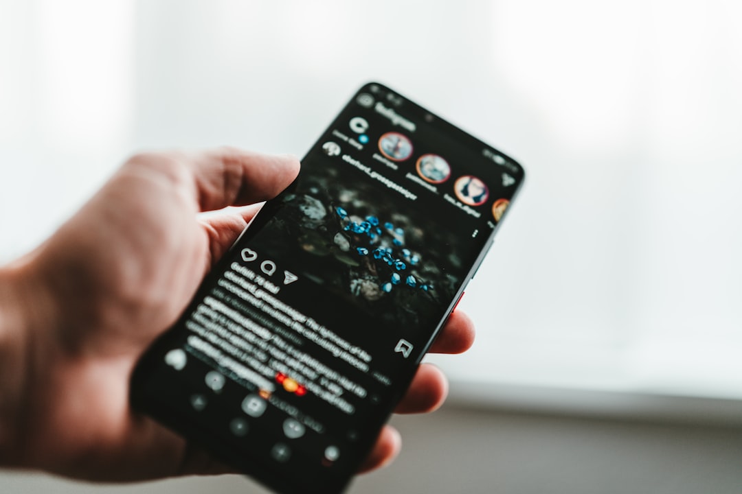 person holding black android smartphone,