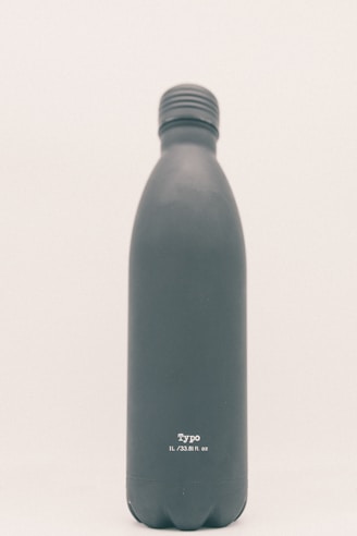 green and white labeled bottle