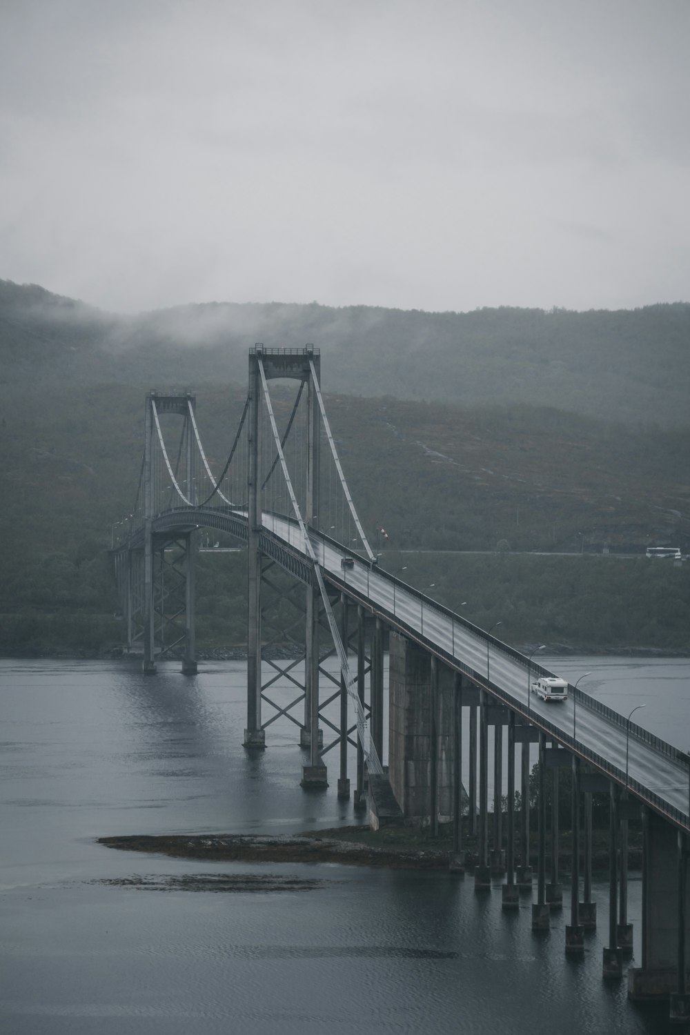 gray bridge over body of water