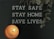 A black letter board displays the message 'STAY SAFE STAY HOME SAVE LIVES.' A lit candle is positioned in the lower left corner, casting a warm glow. Dried eucalyptus leaves hang from the top right corner, adding a natural element.