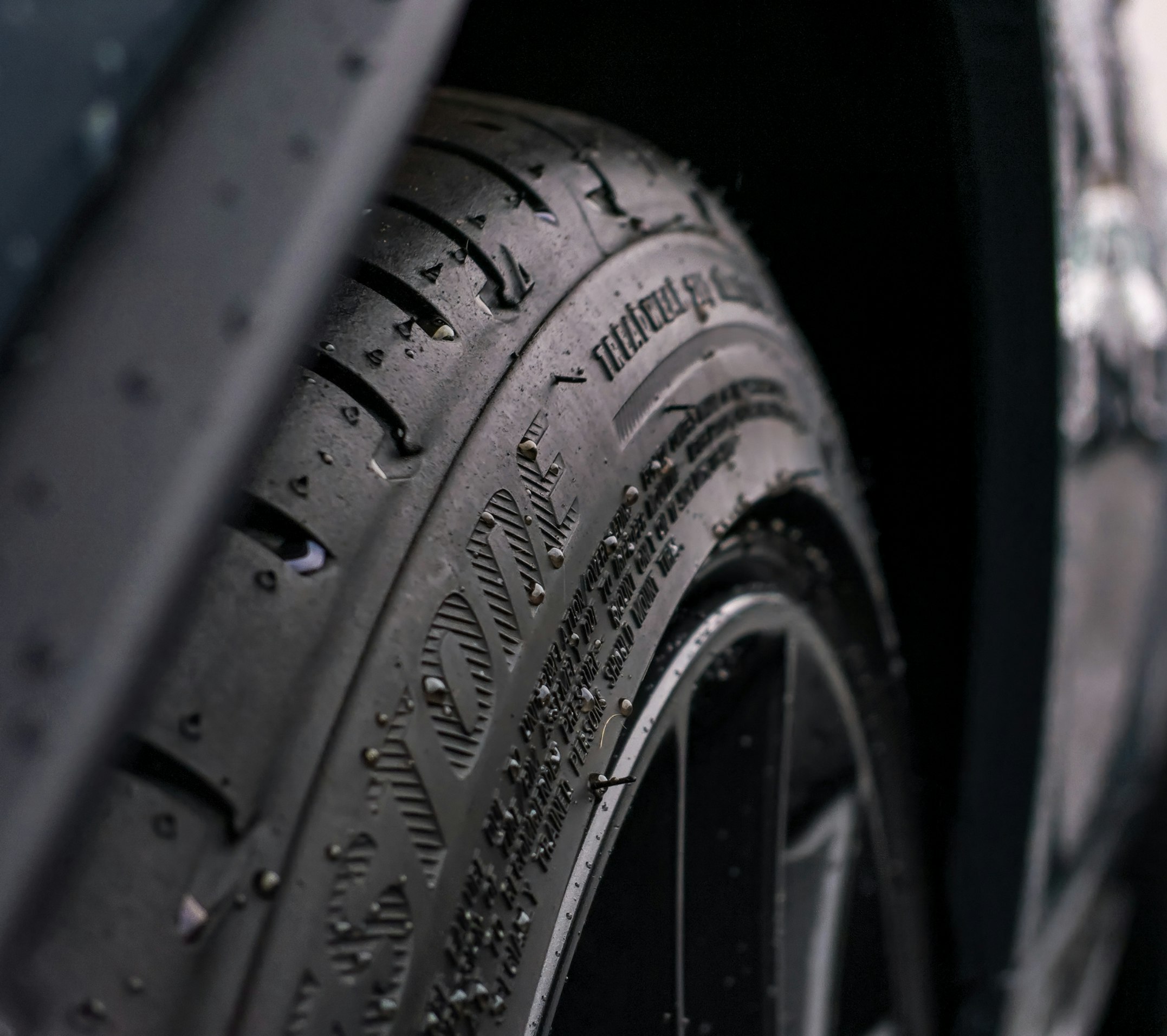 A tire that you can see the tread on, indicating that it is new