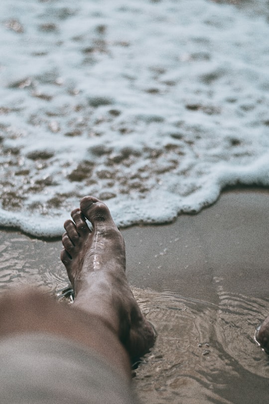 persons feet on beach during daytime in Šolta Croatia