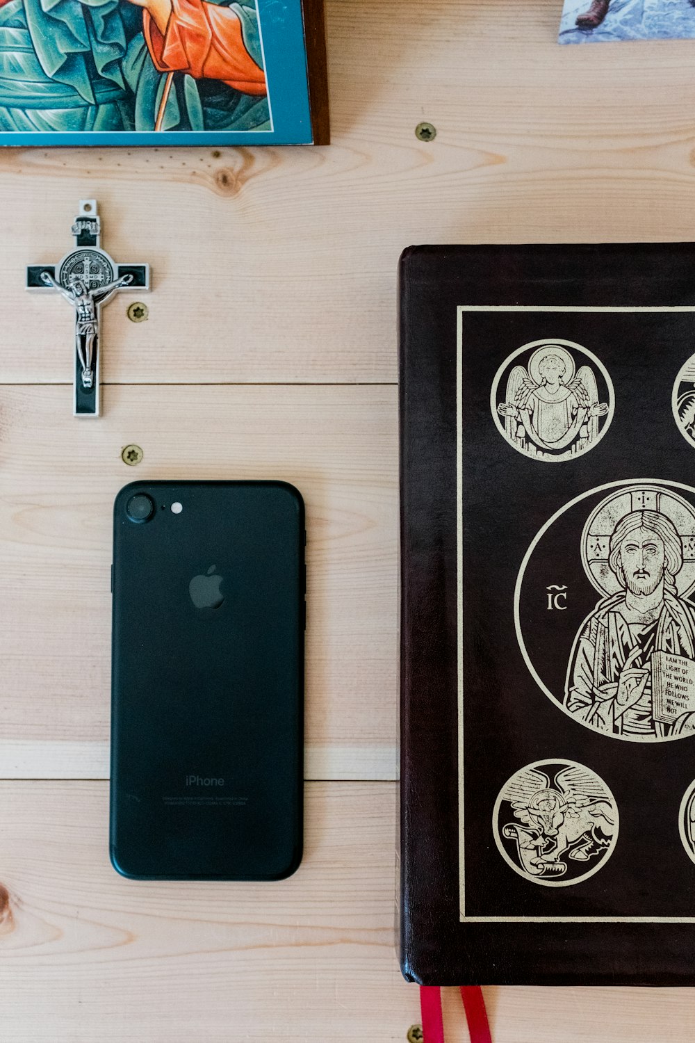 black iphone 7 on brown wooden table