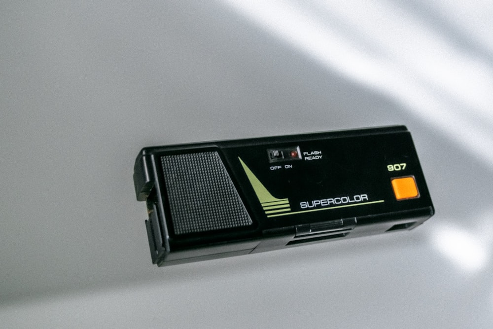 a black radio sitting on top of a white table