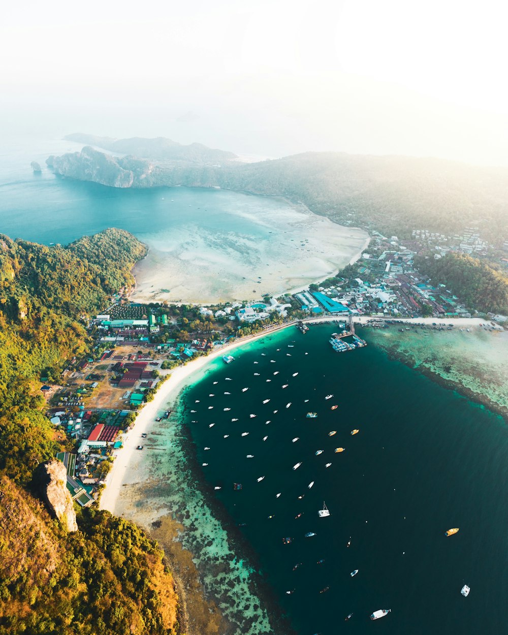 aerial view of city near body of water during daytime