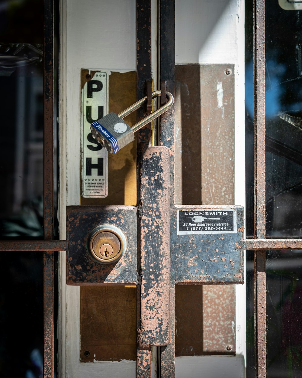 brown wooden door with padlock