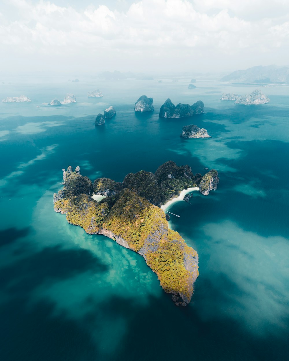 aerial view of island in the middle of ocean