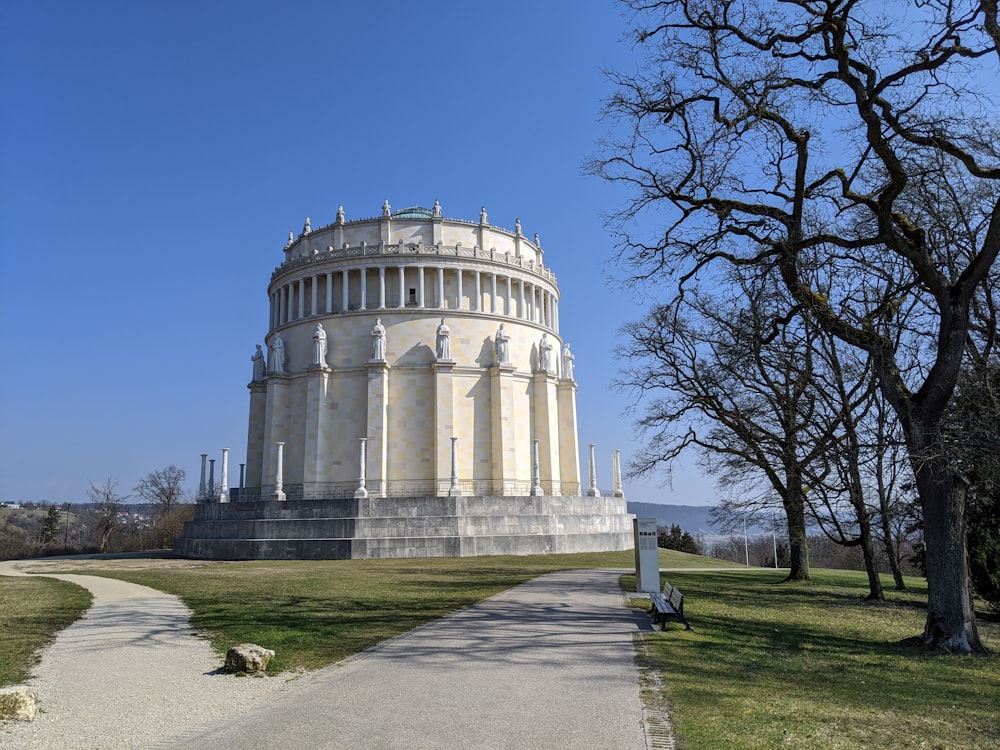 white concrete building near bare trees during daytime