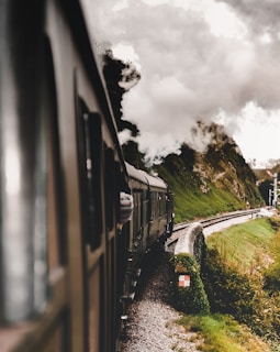 train on rail during daytime