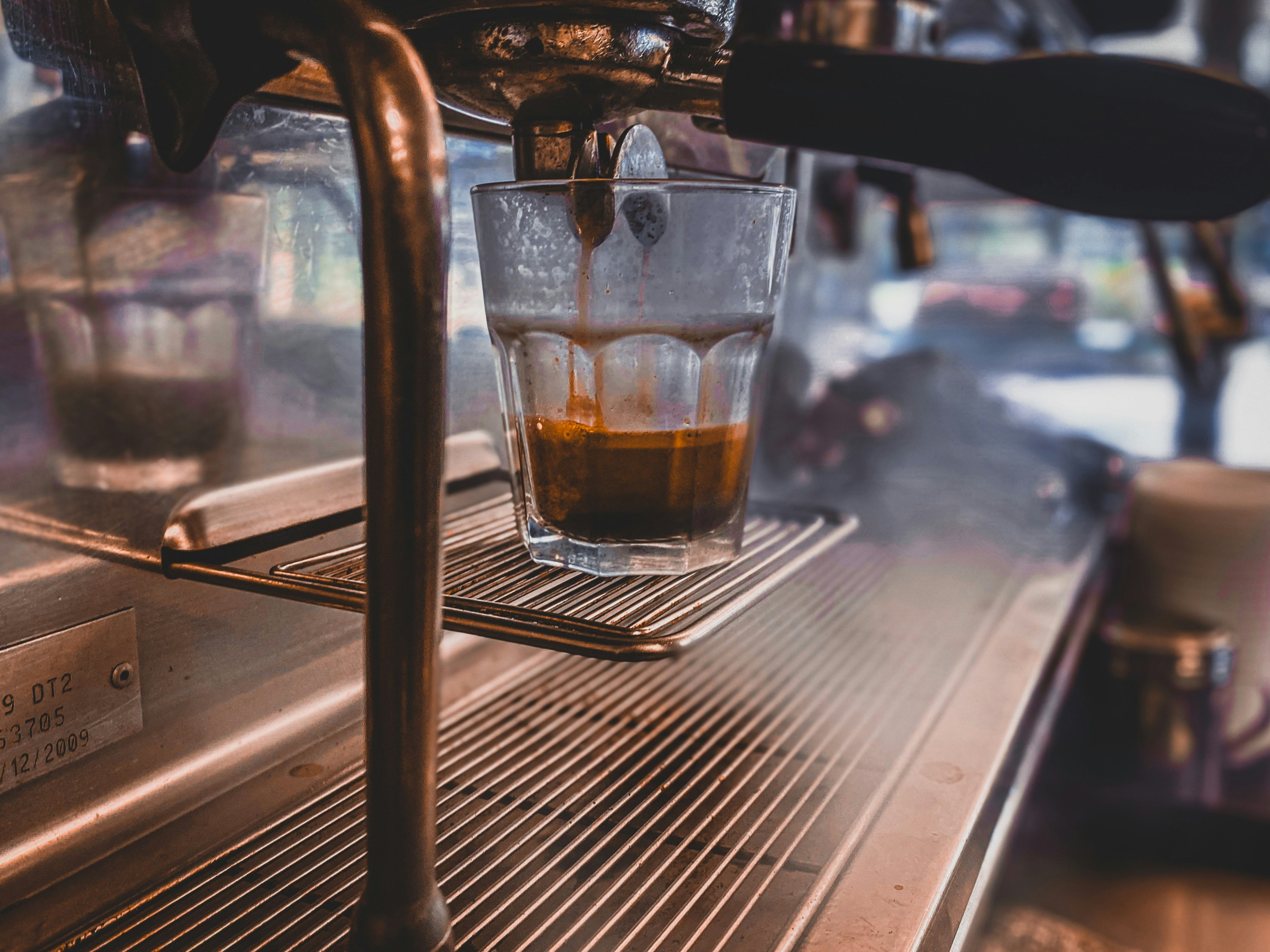 clear drinking glass with brown liquid