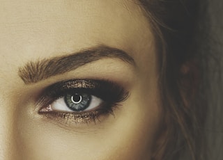 woman with red lipstick and black mascara