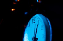 Close-up of a modern clock showing the time in a bright setting.