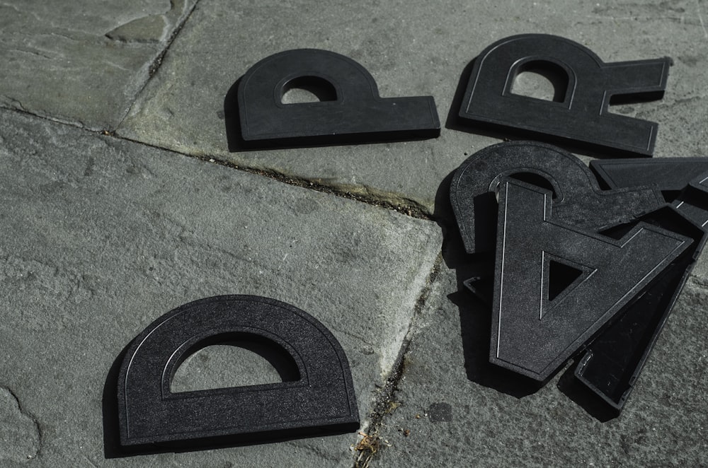 black plastic tool on gray concrete floor