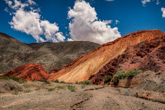 brown mountain under blue sky during daytime in Jujuy Argentina