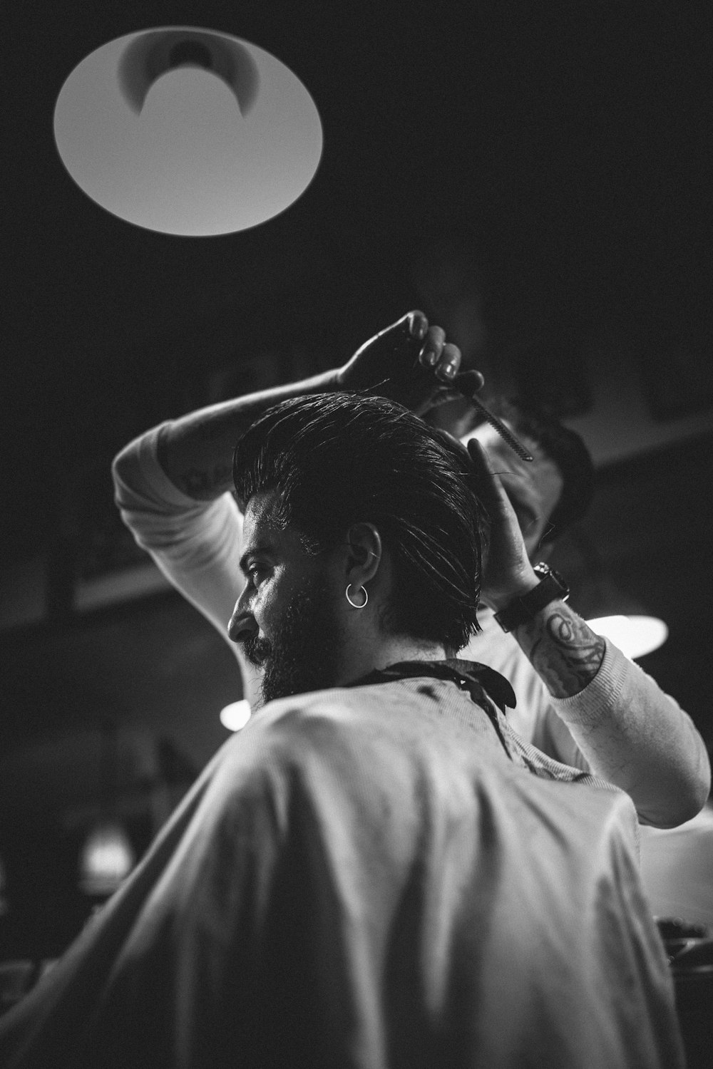 grayscale photo of man in white shirt