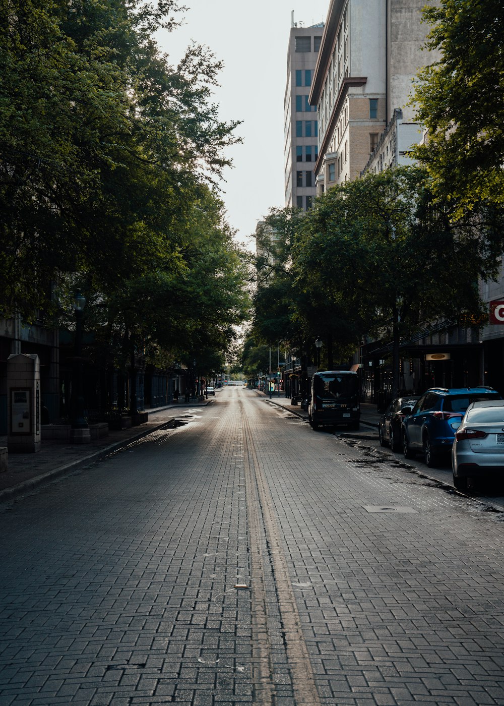 cars parked on side of the road during daytime