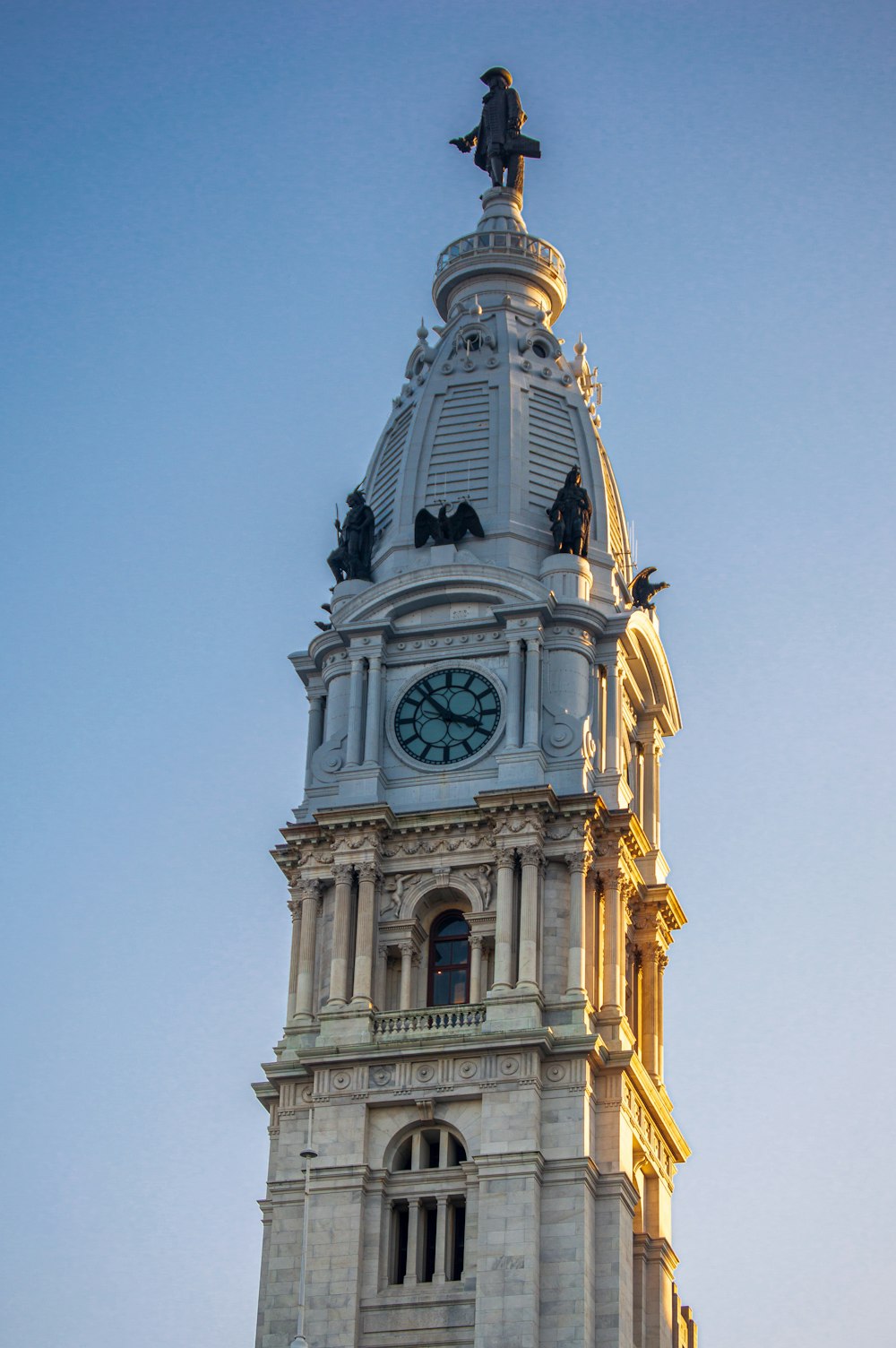 white and gold clock tower