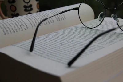 Placeholder image representing the book discussion with an open book and reading glasses.