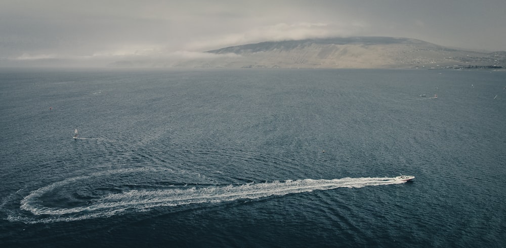 ocean waves crashing on shore during daytime