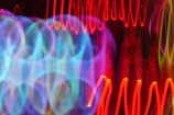 Abstract sound waves pulsing in bright colors representing ritmoviva's original beats.