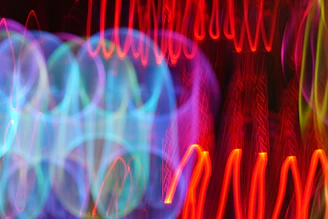 Vibrant abstract sound waves pulsing with energy and color.