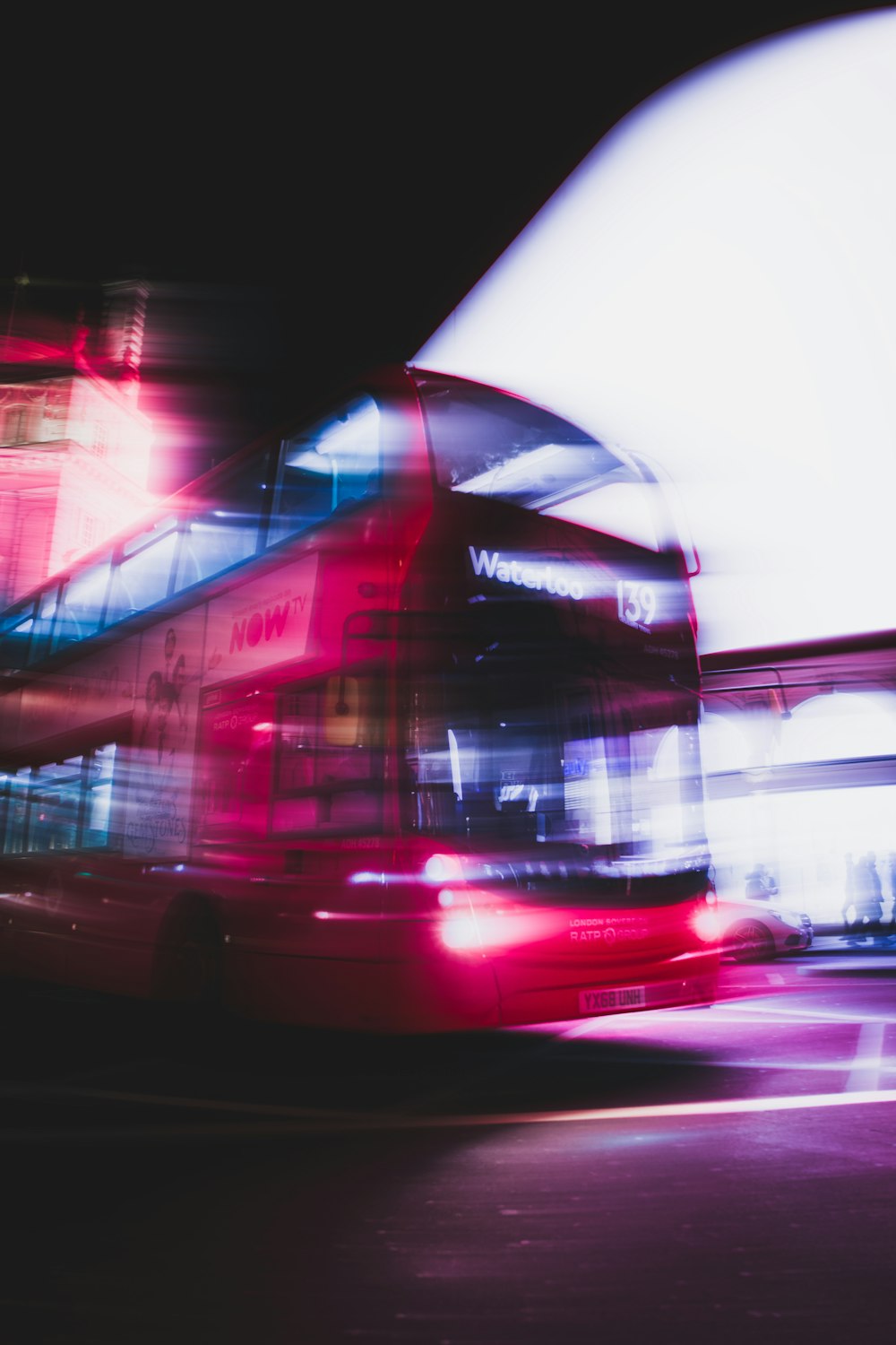 red and white bus on road during daytime