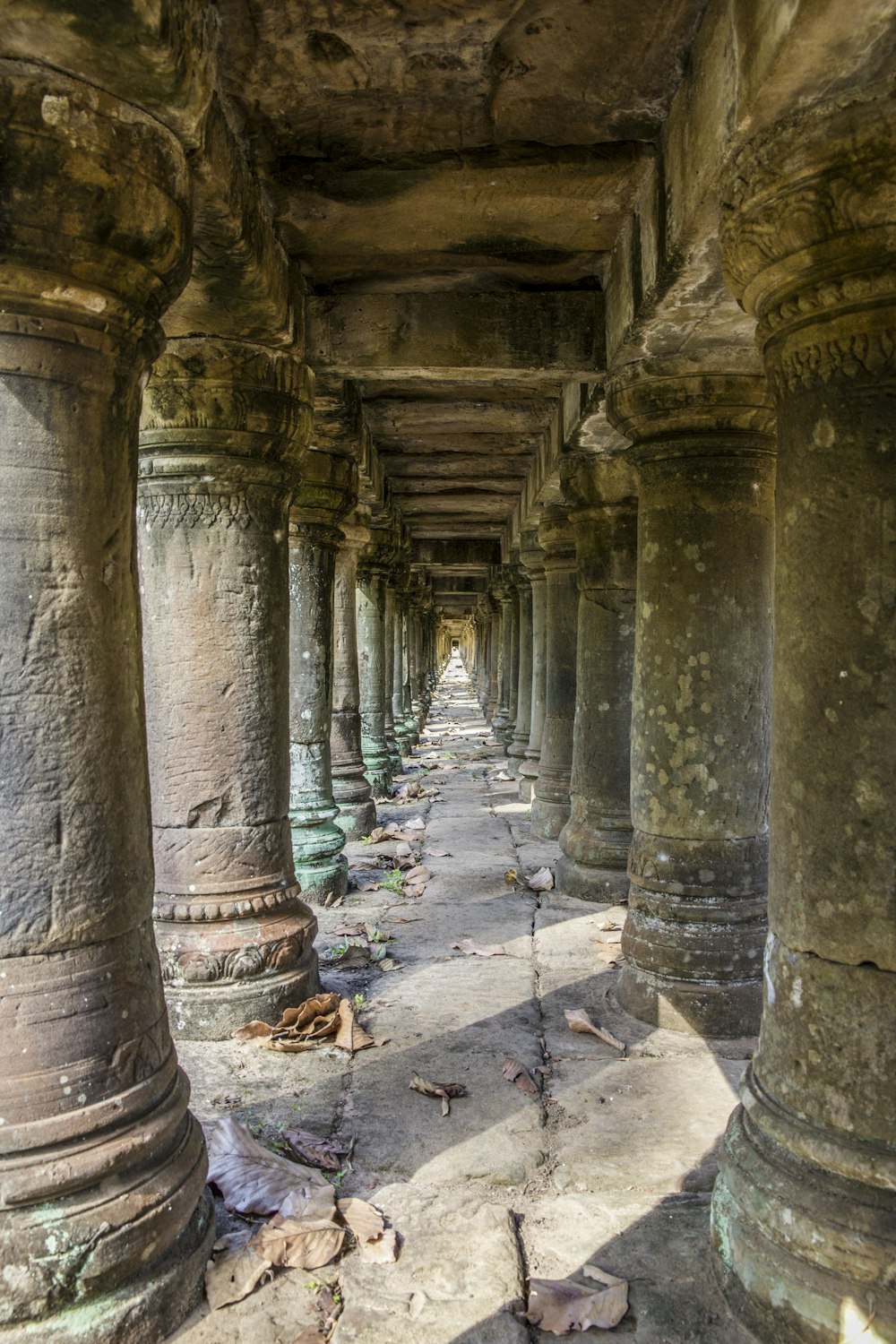 brown concrete posts on gray concrete floor