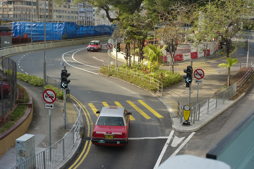 red car on road during daytime