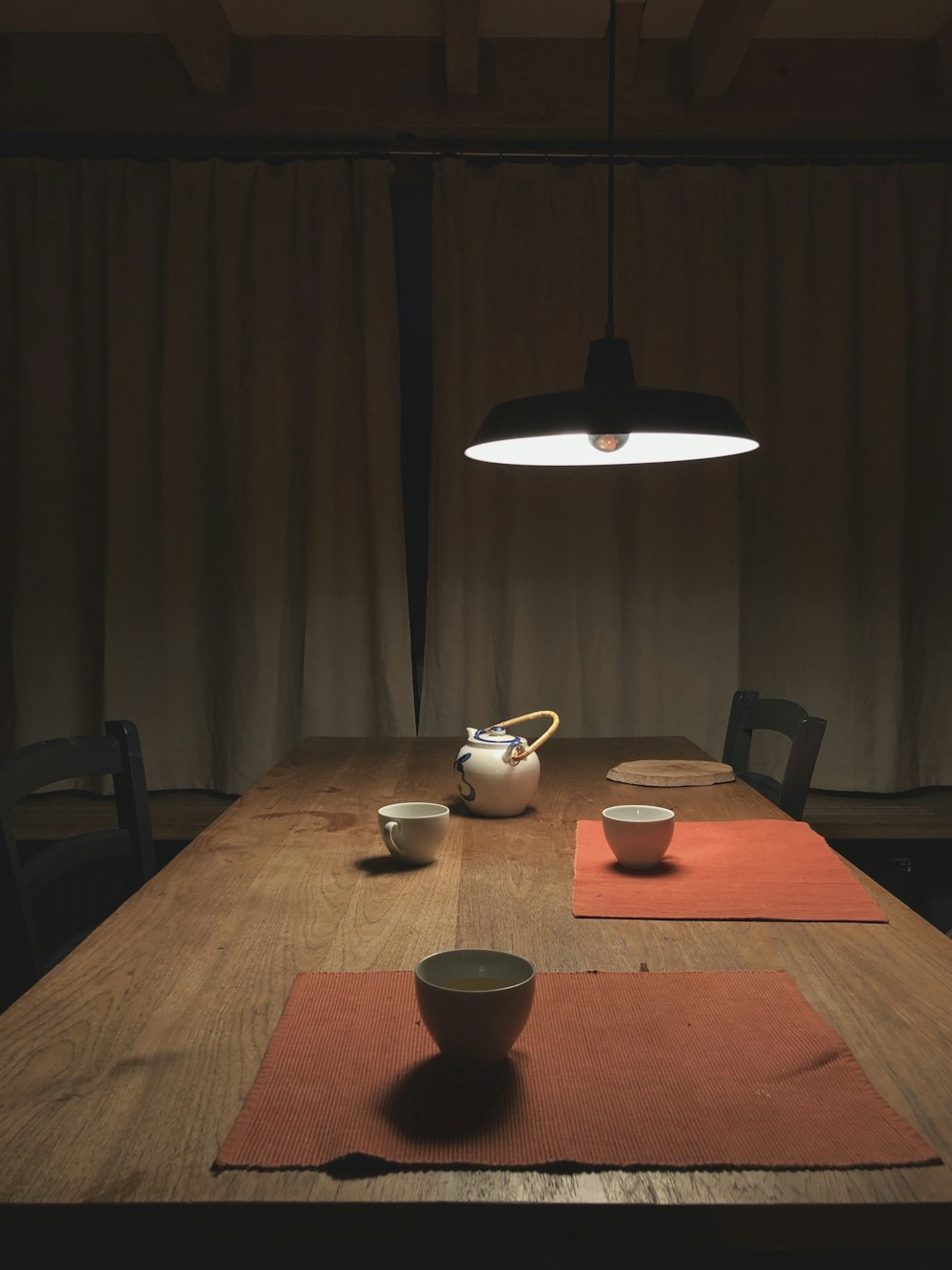 brown wooden table with chairs