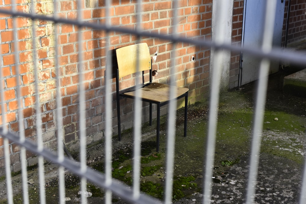 black metal fence near brown wooden table