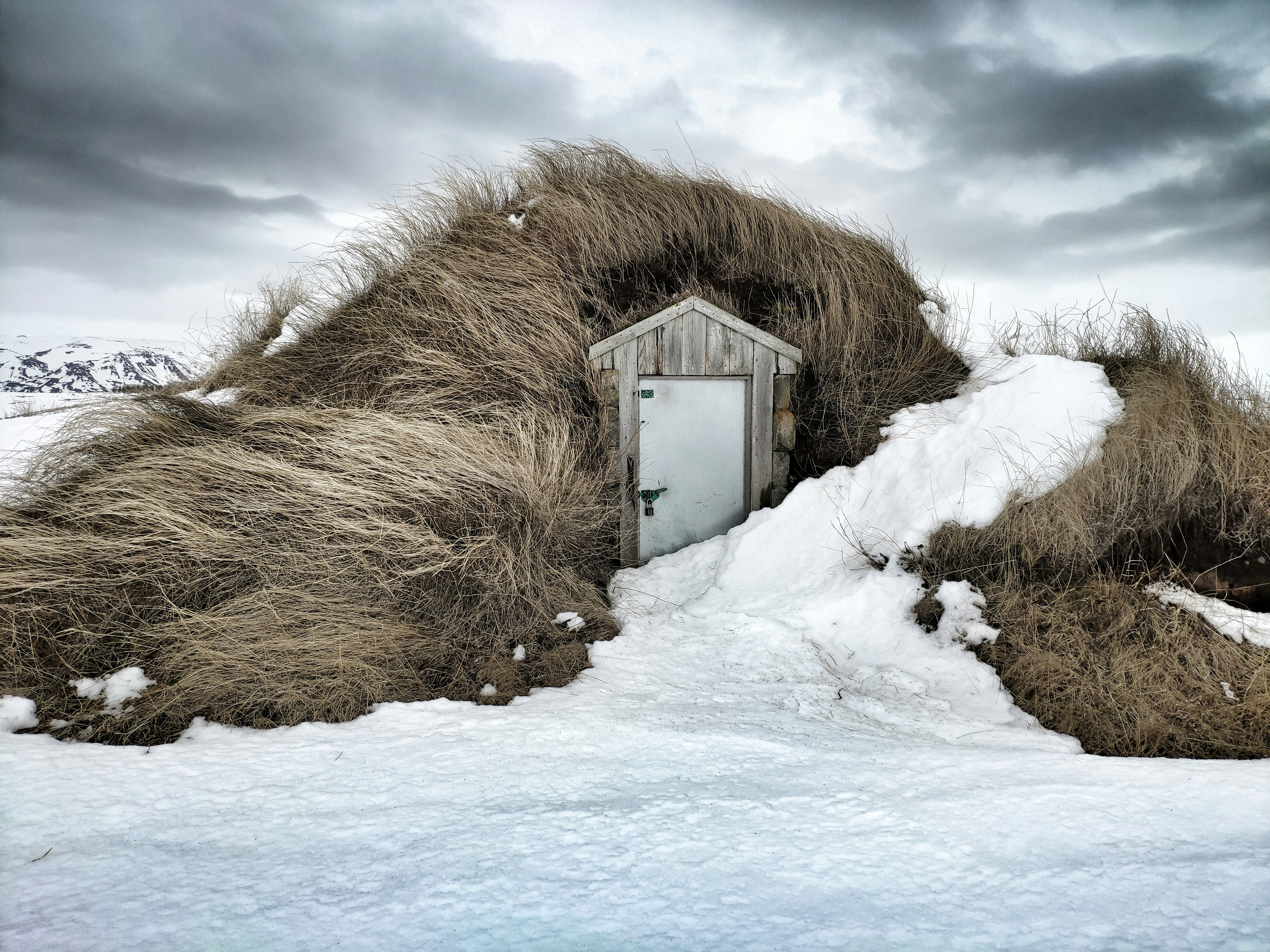 brown wooden house on snow covered ground under white clouds and blue sky during daytime, Icelandic Home</p><p>Turf House</p><p>Iceland