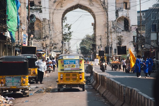 yellow and white bus on road during daytime in Hyderabad India