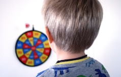 boy in green and blue crew neck shirt
