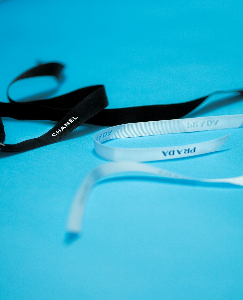 black and white sunglasses on blue surface